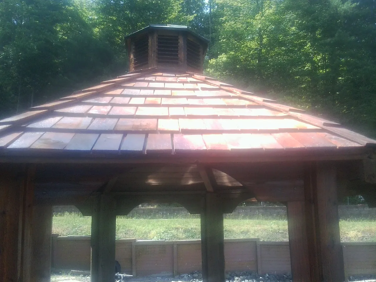 New cedar shake roof and cupola on a lakeside gazebo in Thatcher